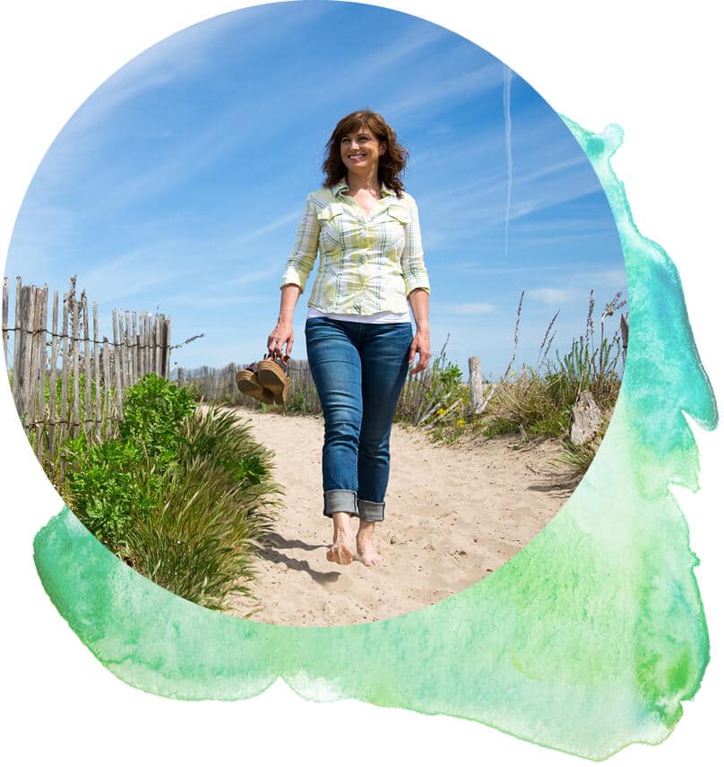 Women walking on beach.