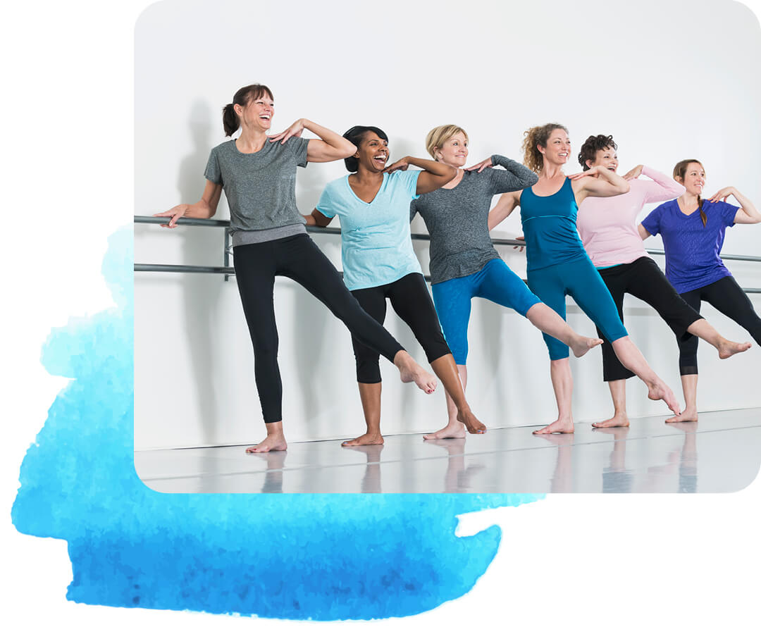 Six women lined up holding a bar and lifting their legs slightly above the ground